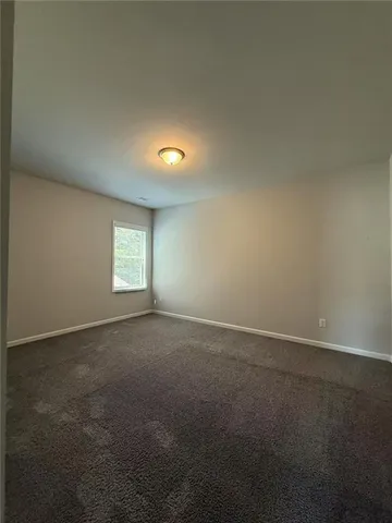 an empty room that has windows