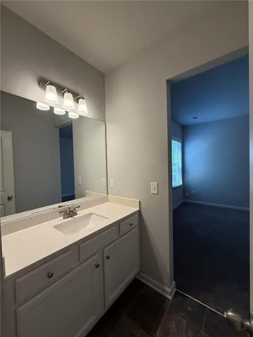 a bathroom with a double vanity sink and a mirror