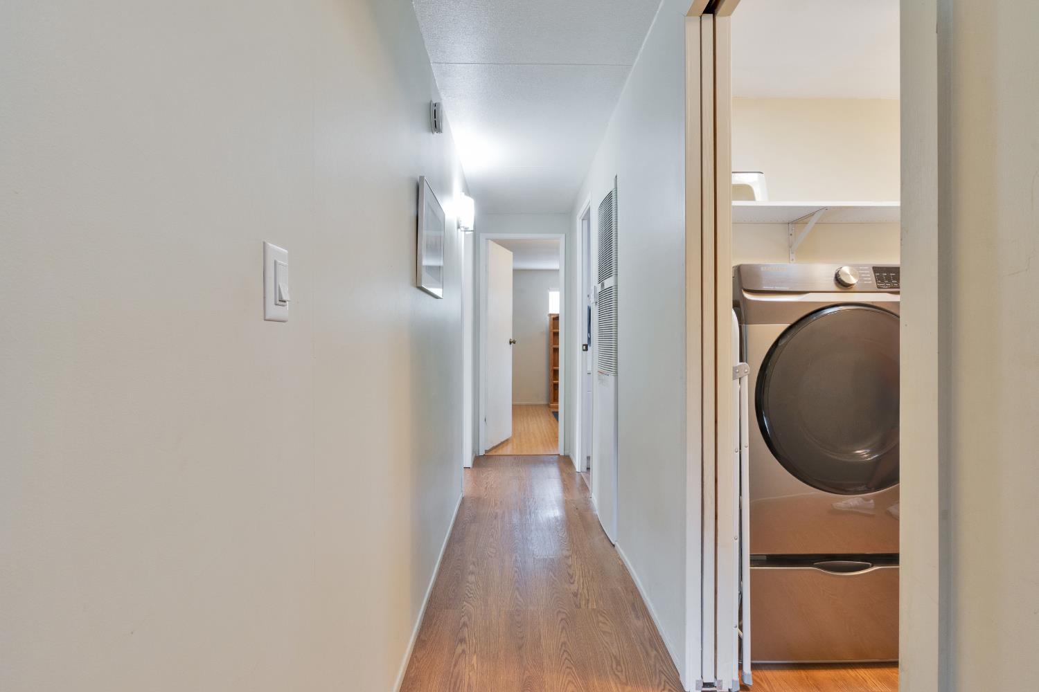 472 Oleander View Way Rancho Cordova, CA 95670 - Photo 11 of 21 a view of a hallway with wooden floor