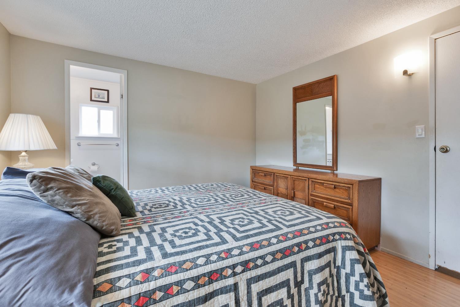 472 Oleander View Way Rancho Cordova, CA 95670 - Photo 15 of 21 a bedroom with a bed and a lamp