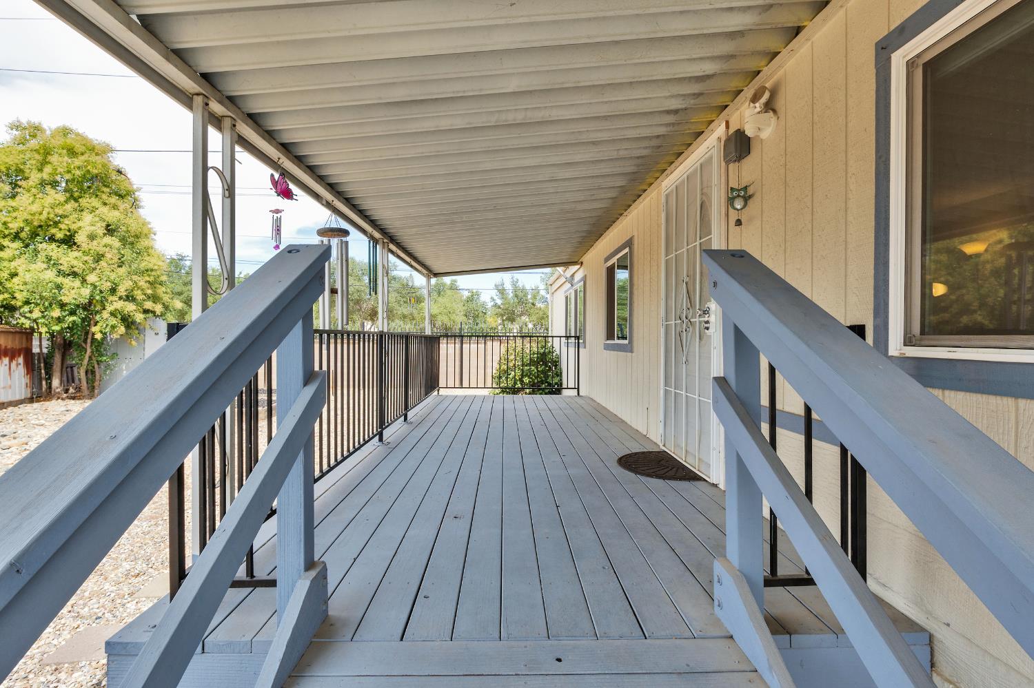 472 Oleander View Way Rancho Cordova, CA 95670 - Photo 4 of 21 a view of balcony with wooden floor and iron stairs