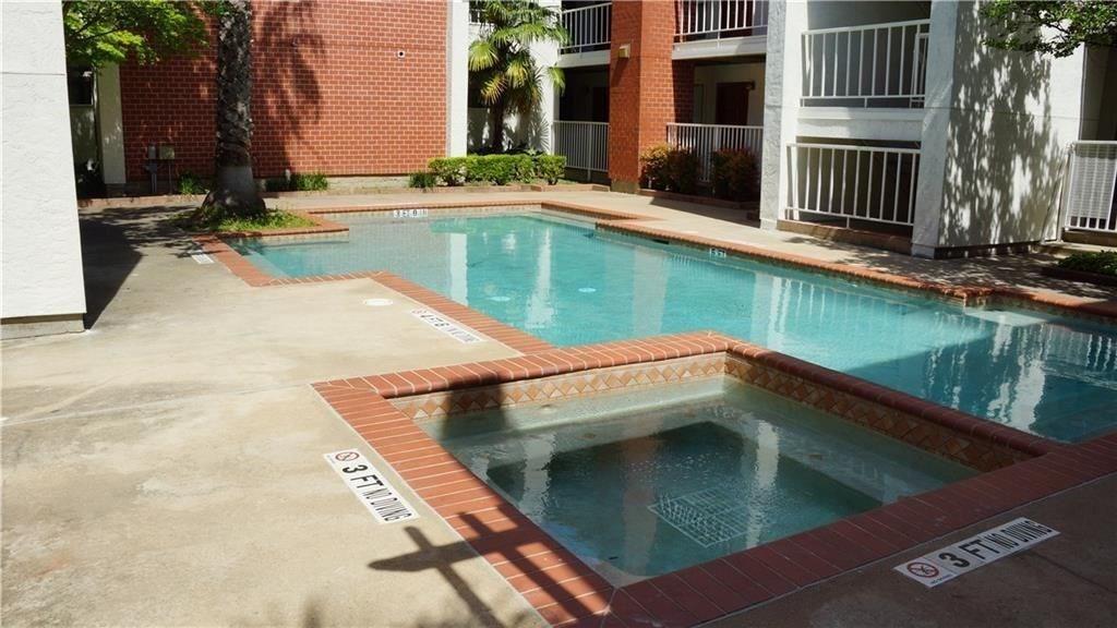 a view of swimming pool with outdoor seating