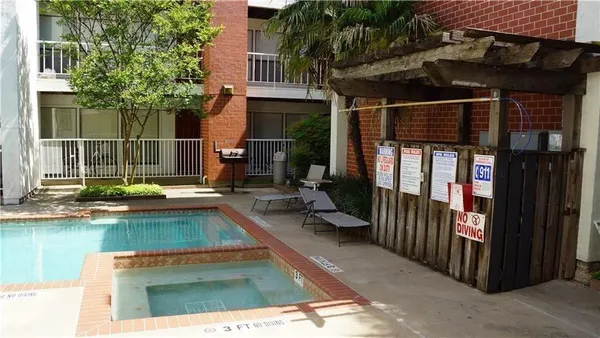 a view of a house with swimming pool in front of it
