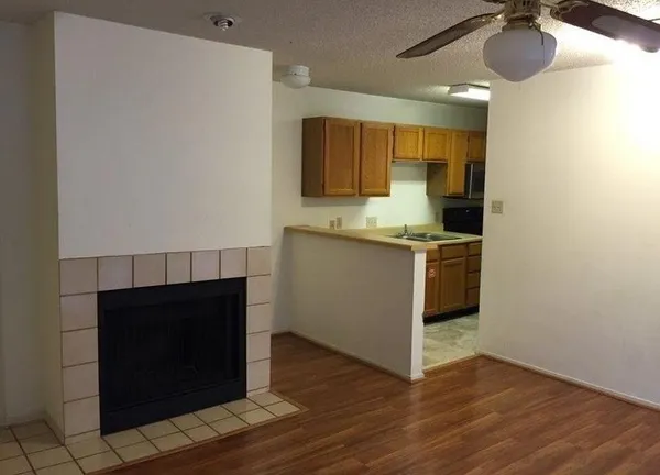 a kitchen with stainless steel appliances granite countertop a sink and a stove top oven