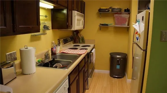 a kitchen with a sink and a refrigerator