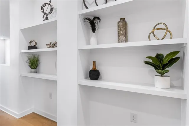 a potted plant sitting on a shelf with a potted plant