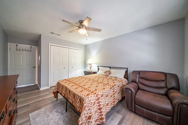 a bedroom with a bed and a window