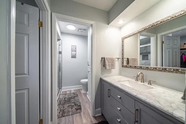 a bathroom with a toilet and shower