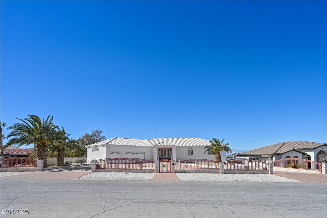 736 Kiel Street Henderson, NV 89015 - Photo 1 of 38 View of front of property featuring a fenced front yard, a gate, and decorative driveway