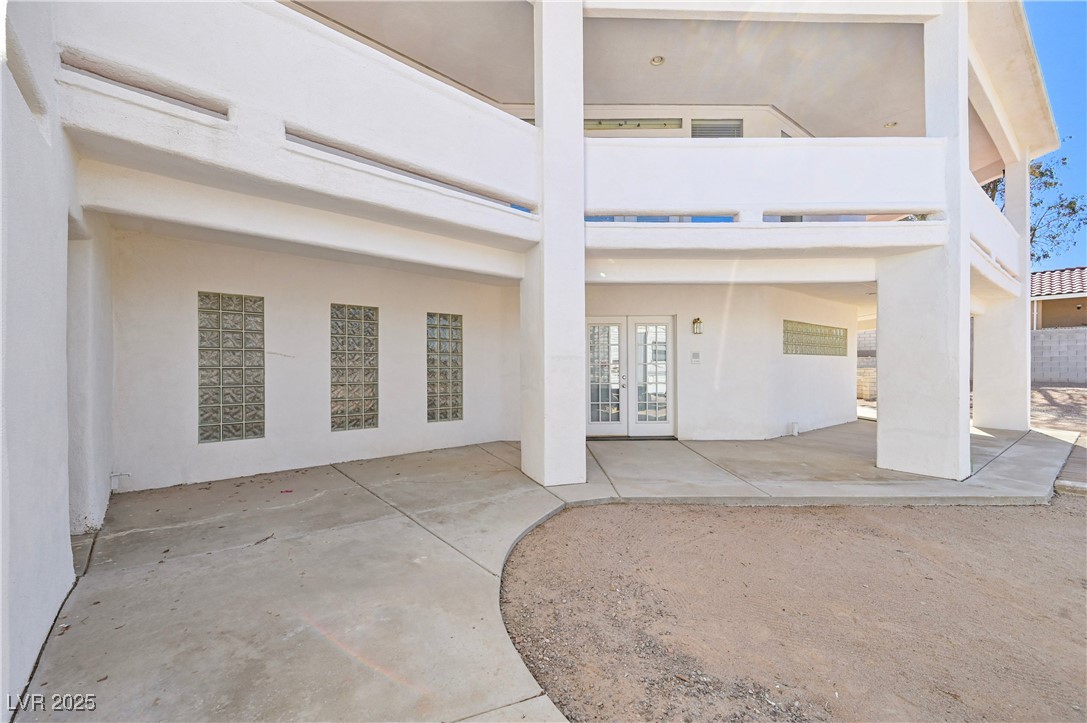 736 Kiel Street Henderson, NV 89015 - Photo 32 of 38 Rear view of house featuring stucco siding, a patio, and french doors