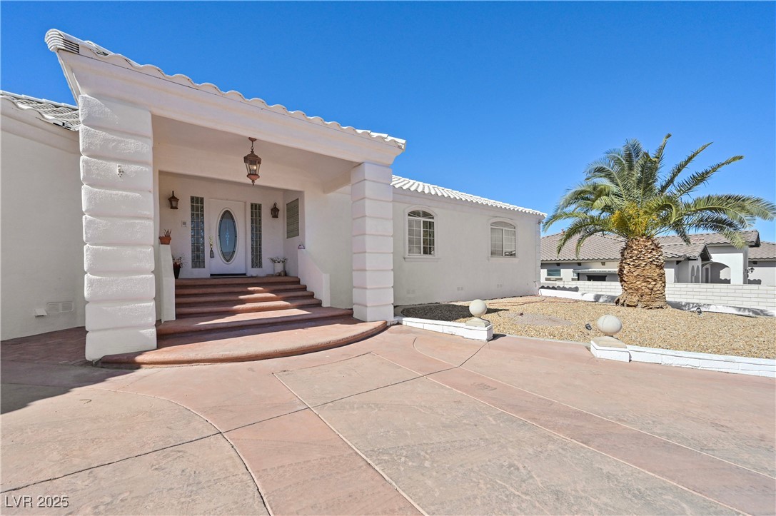736 Kiel Street Henderson, NV 89015 - Photo 7 of 38 Mediterranean / spanish home featuring a tiled roof and stucco siding