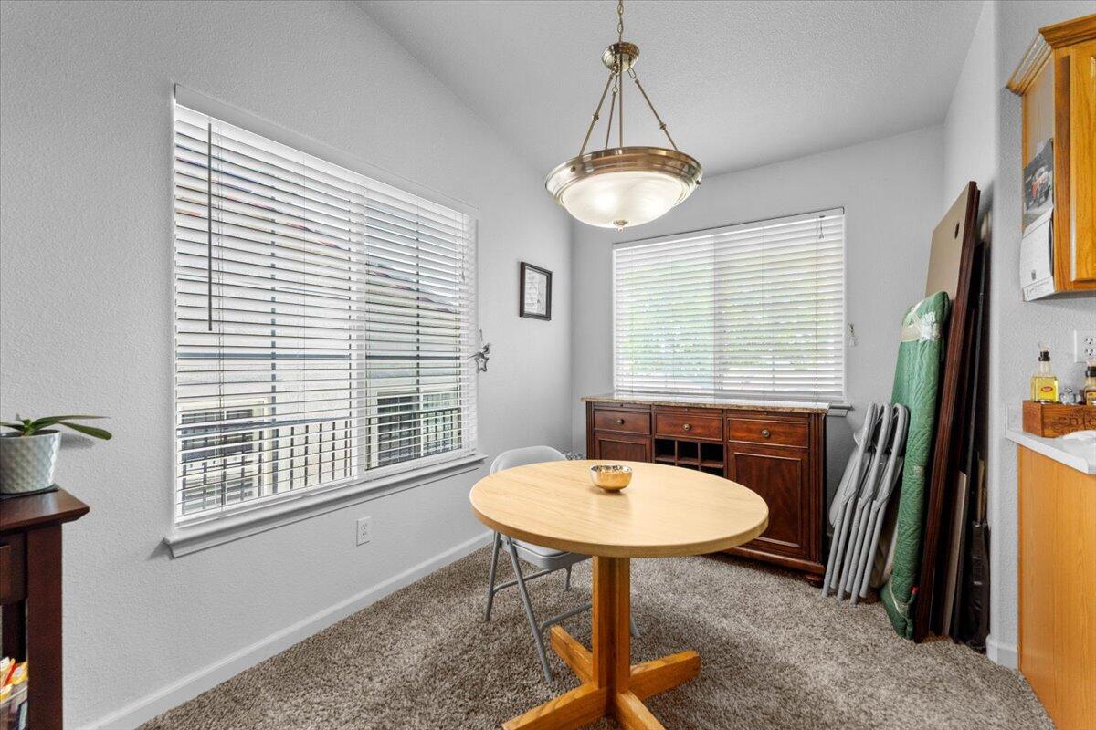 732 Stonebriar Trail Redding, CA 96003 - Photo 12 of 29 a table and chairs in a room