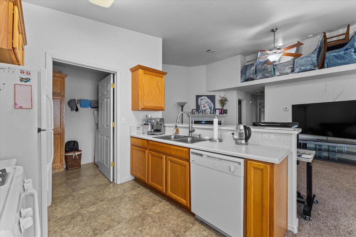 732 Stonebriar Trail Redding, CA 96003 - Photo 14 of 29 a kitchen with stainless steel appliances granite countertop a sink and cabinets