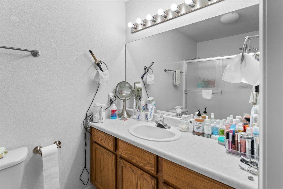 732 Stonebriar Trail Redding, CA 96003 - Photo 18 of 29 a bathroom with a sink vanity and a mirror