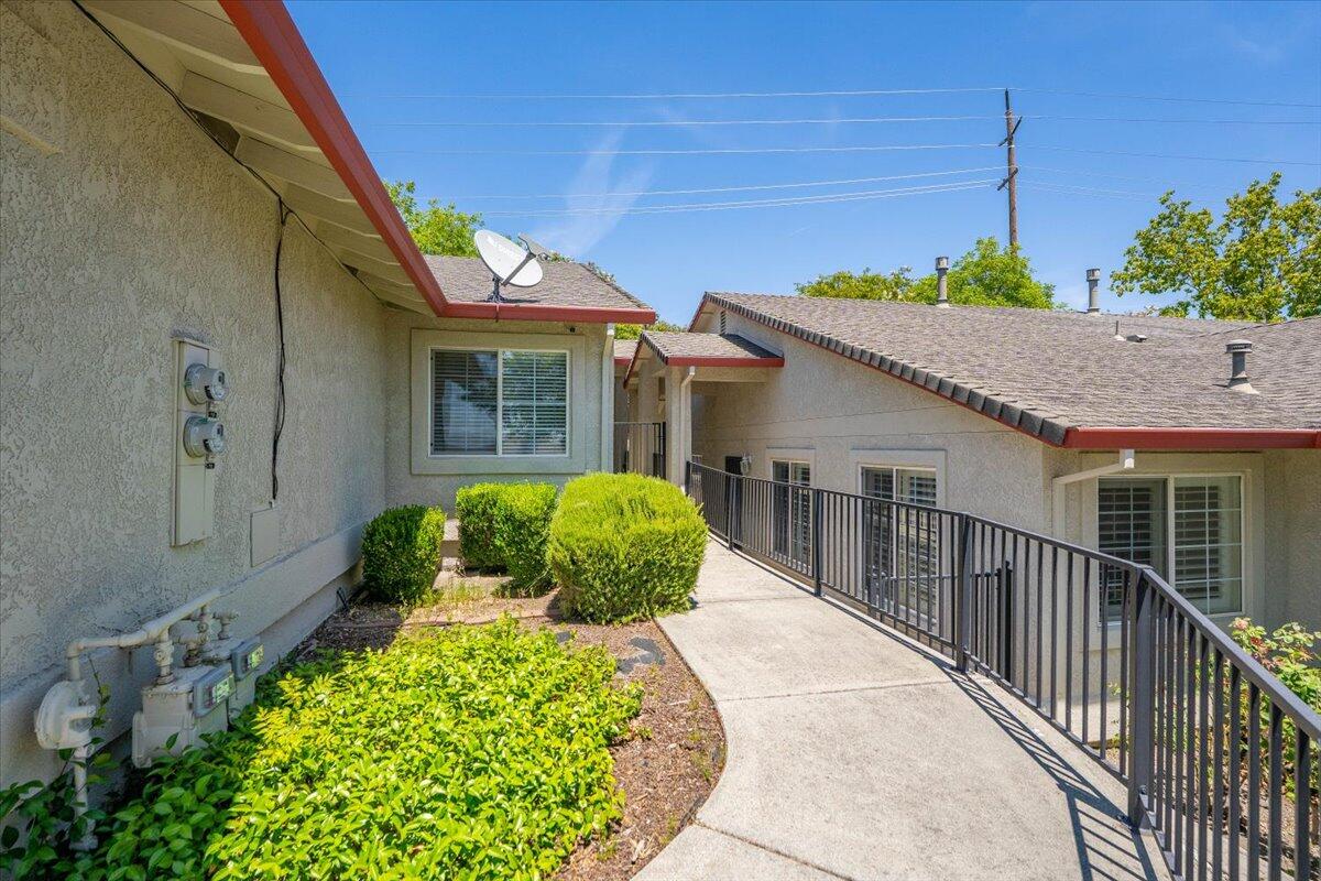 732 Stonebriar Trail Redding, CA 96003 - Photo 3 of 29 a view of a house with a small yard and potted plants