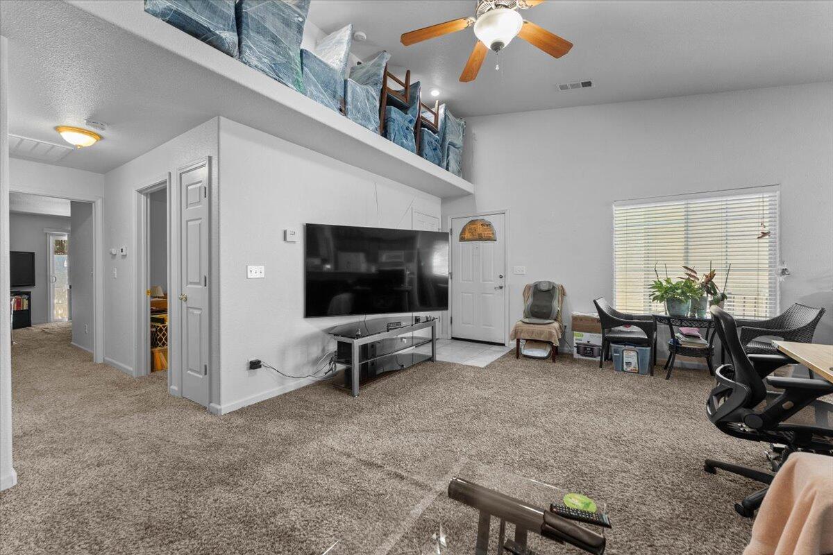 732 Stonebriar Trail Redding, CA 96003 - Photo 9 of 29 a view of a livingroom with furniture and a flat screen tv