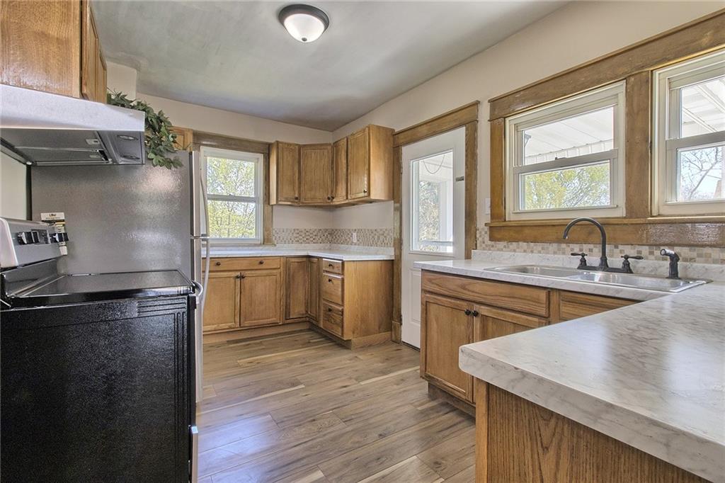 109 Lycippus Hardware Road Latrobe, PA 15650 - Photo 9 of 18 a kitchen with a stove a sink and a refrigerator