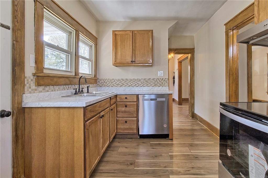 109 Lycippus Hardware Road Latrobe, PA 15650 - Photo 10 of 18 a spacious bathroom with a double vanity sink a mirror and a bathtub