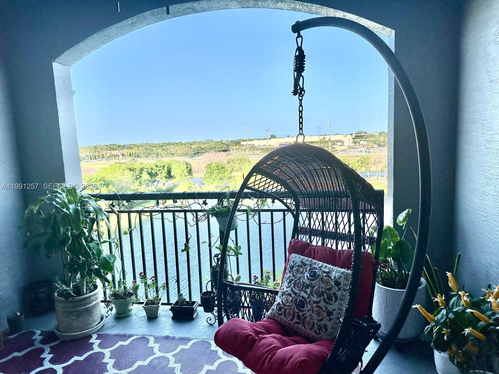 1660 Renaissance Commons Boulevard, Unit 2606 Boynton Beach, FL 33426 - Photo 4 of 26 a view of a balcony with an outdoor space