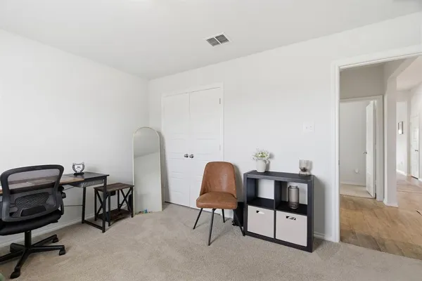 a view of a city from a dining room with furniture