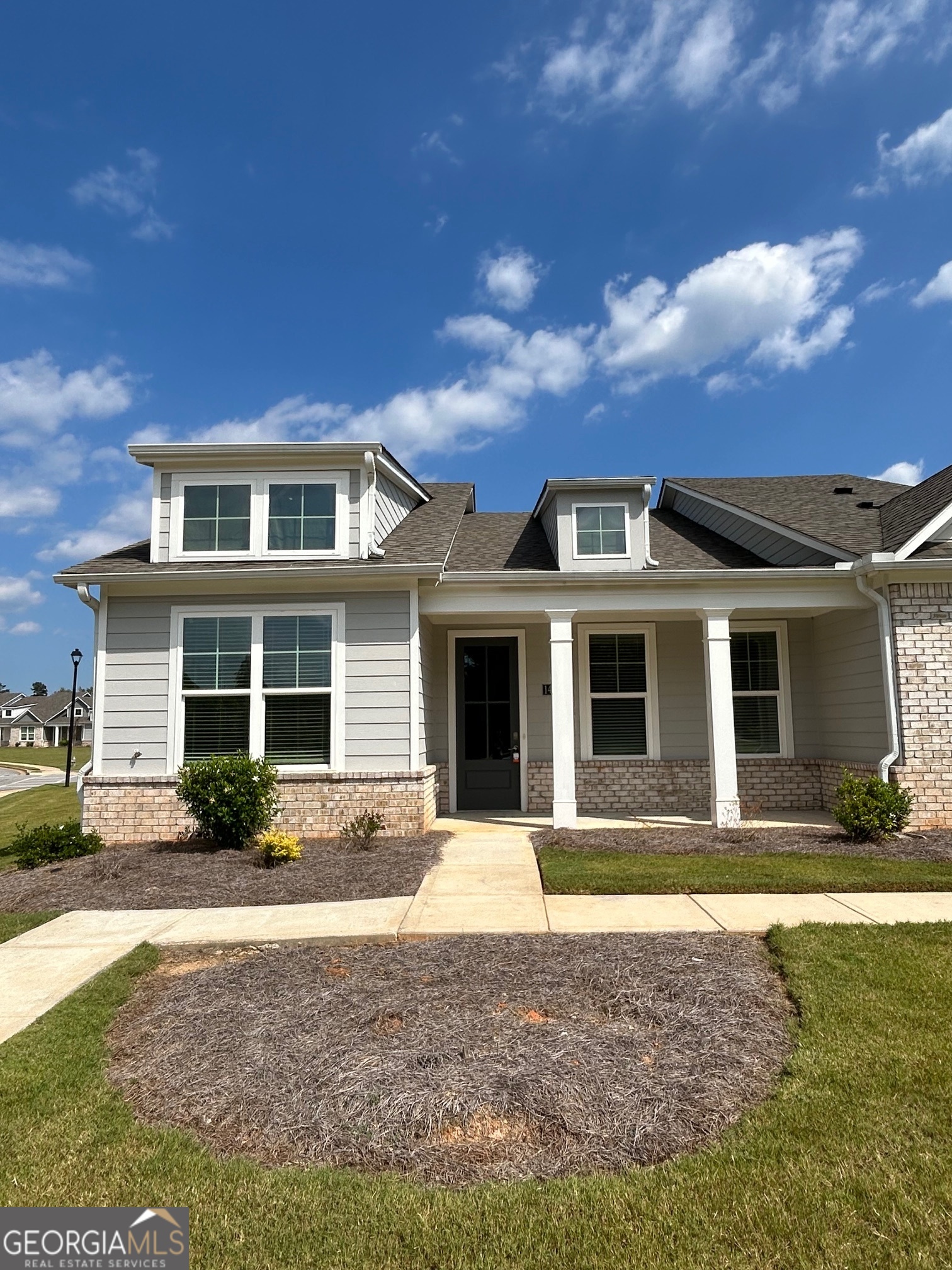 1453 Proust Lane, Unit 1453 Stockbridge, GA 30281 - Photo 1 of 26 a front view of a house with yard