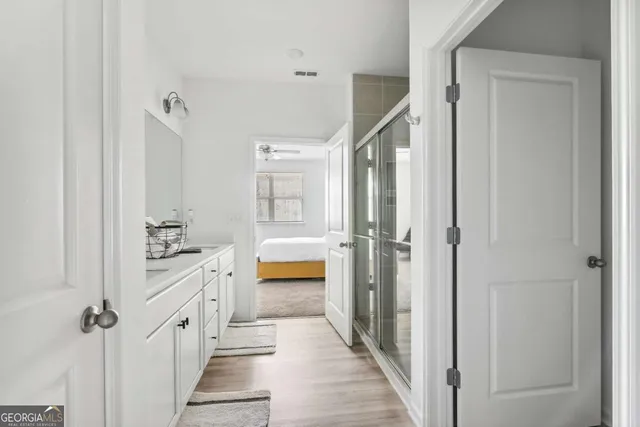 a bathroom with a tub and shower