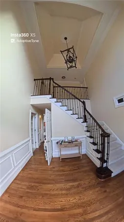 a bedroom with a bed and a ceiling fan
