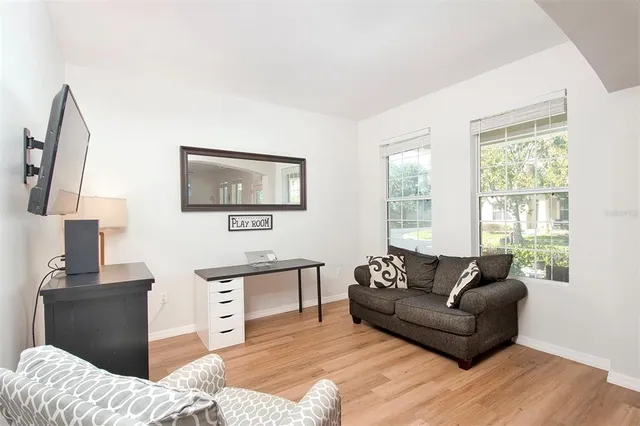 a living room with furniture or couch and a window