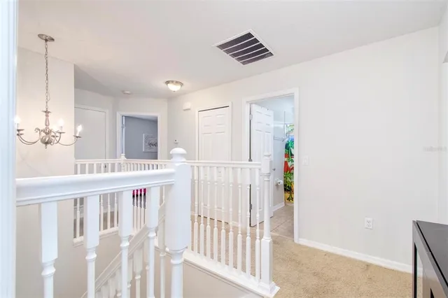 a view of staircase with white walls