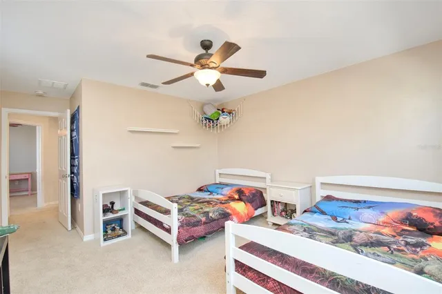 a bedroom with furniture and a window