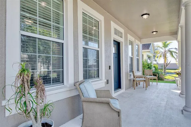 a lobby with furniture and a potted plant