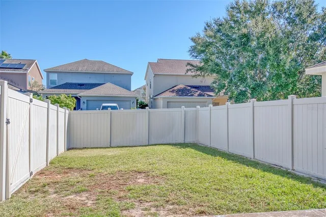a view of a backyard of the house