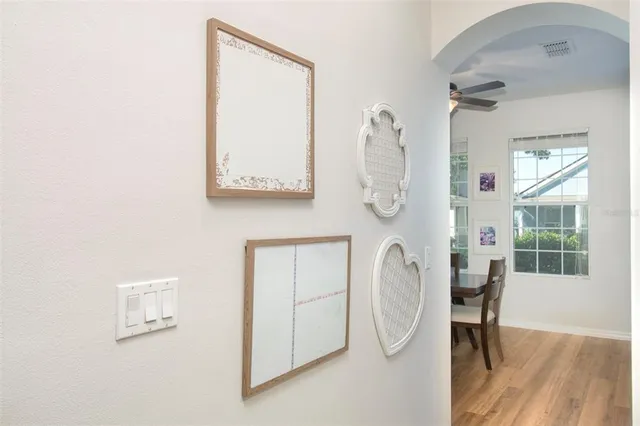 a bathroom with a toilet and a mirror