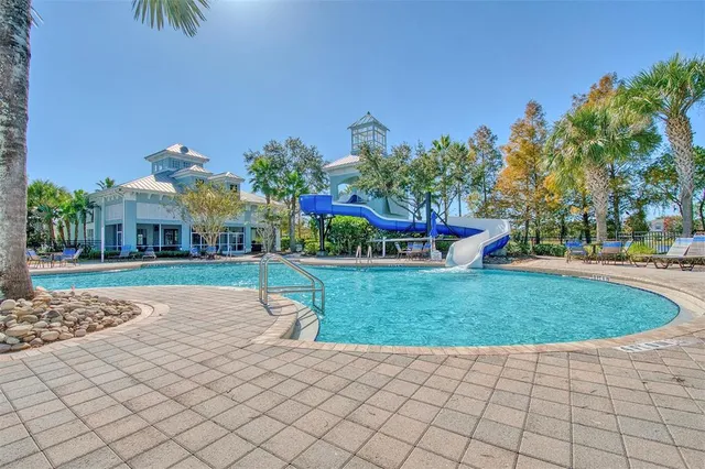 a very nice looking dining room with a large window