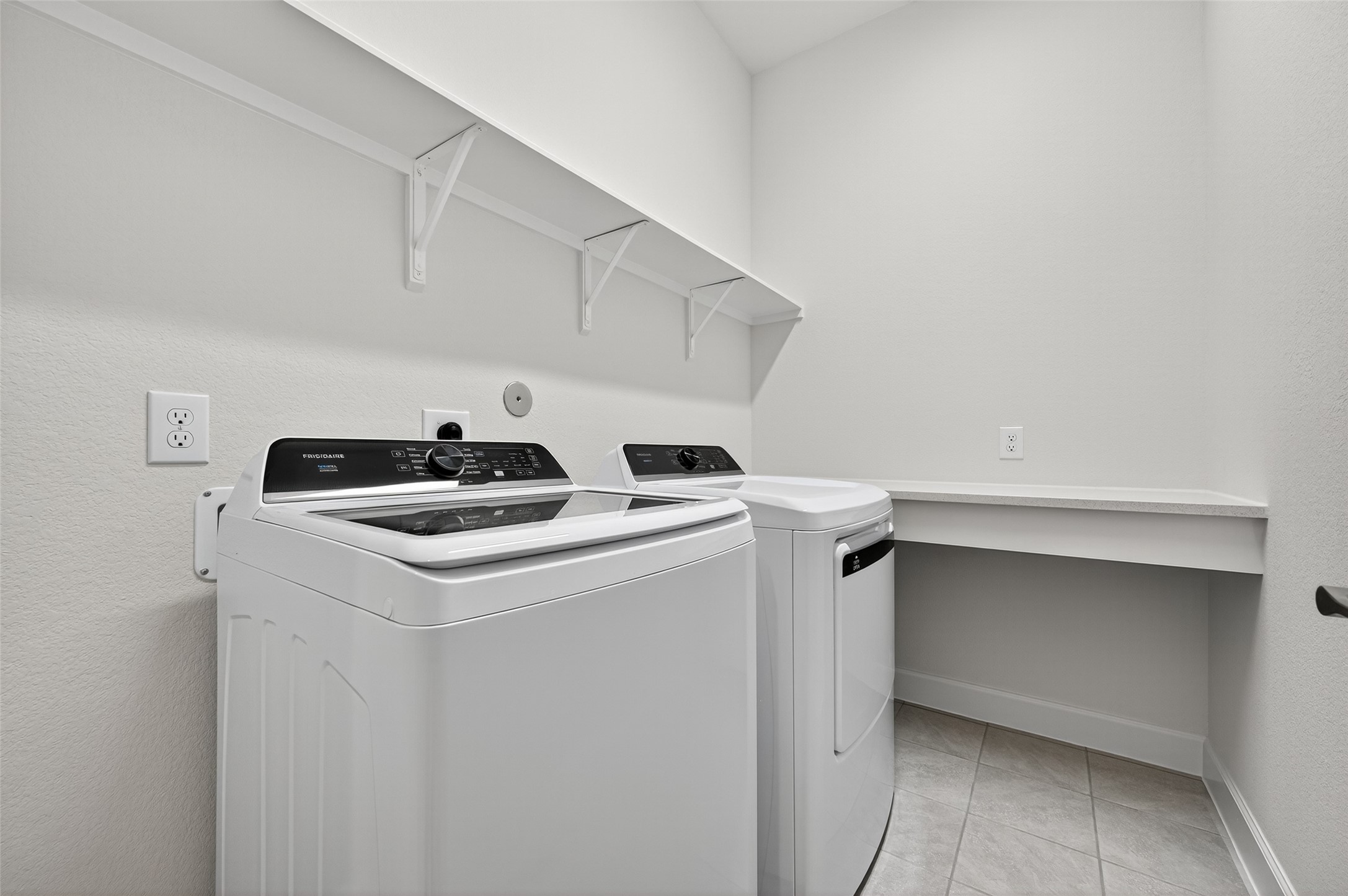 11219 Peacock Flower Street Cypress, TX 77433 - Photo 11 of 50 a utility room with dryer and washer