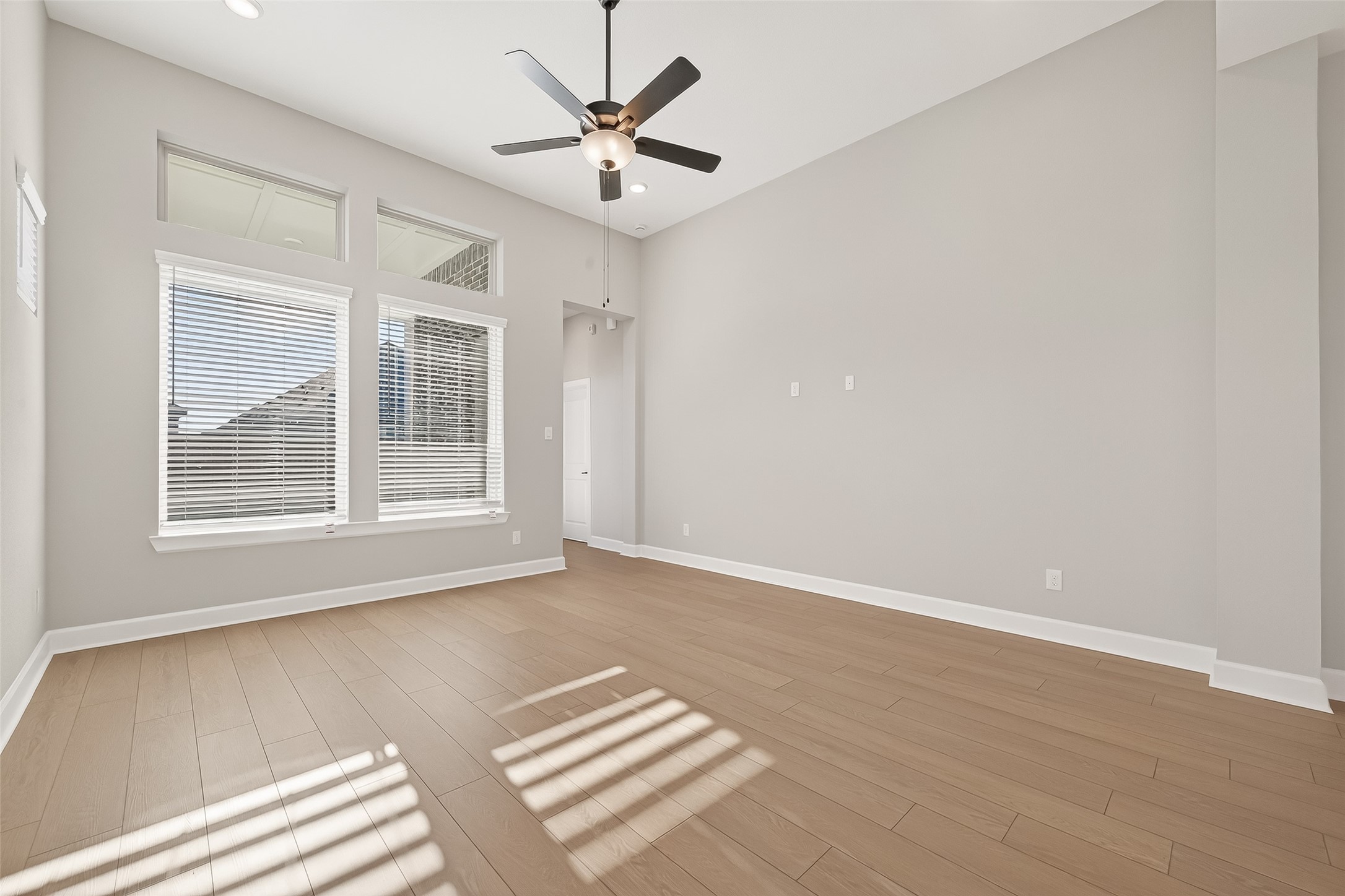 11219 Peacock Flower Street Cypress, TX 77433 - Photo 12 of 50 a view of an empty room with a window