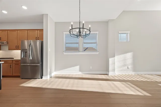 a kitchen with kitchen island a sink stainless steel appliances and cabinets