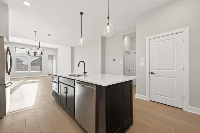 a kitchen with granite countertop cabinets and white appliances
