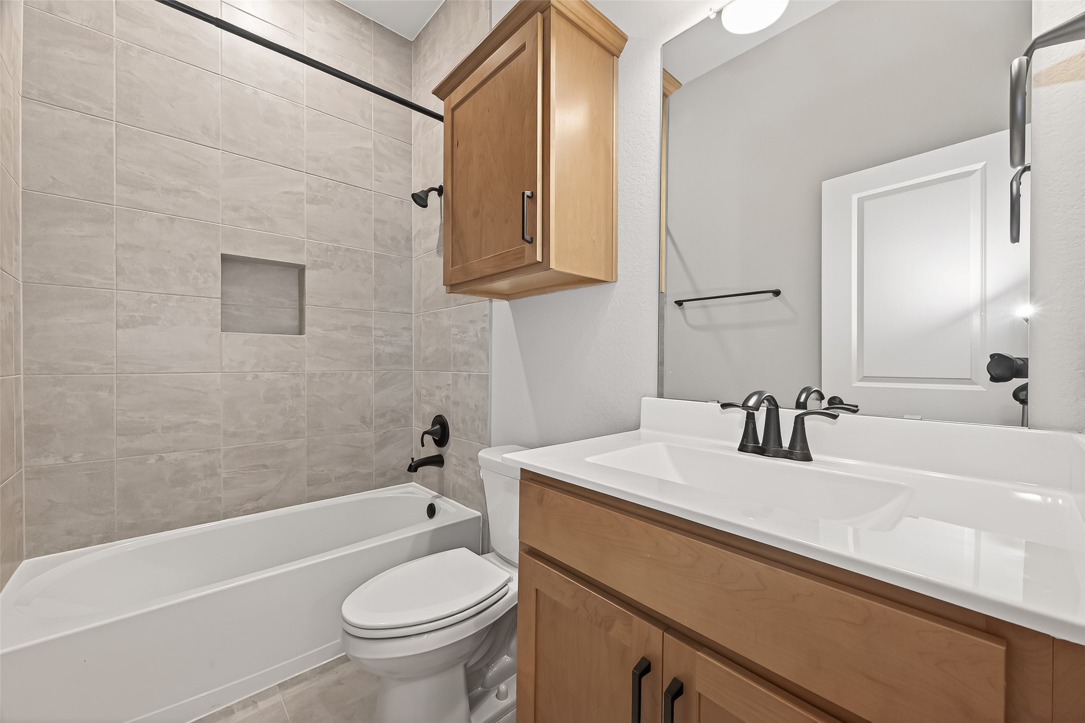 11219 Peacock Flower Street Cypress, TX 77433 - Photo 28 of 50 a bathroom with a sink a toilet and a bathtub