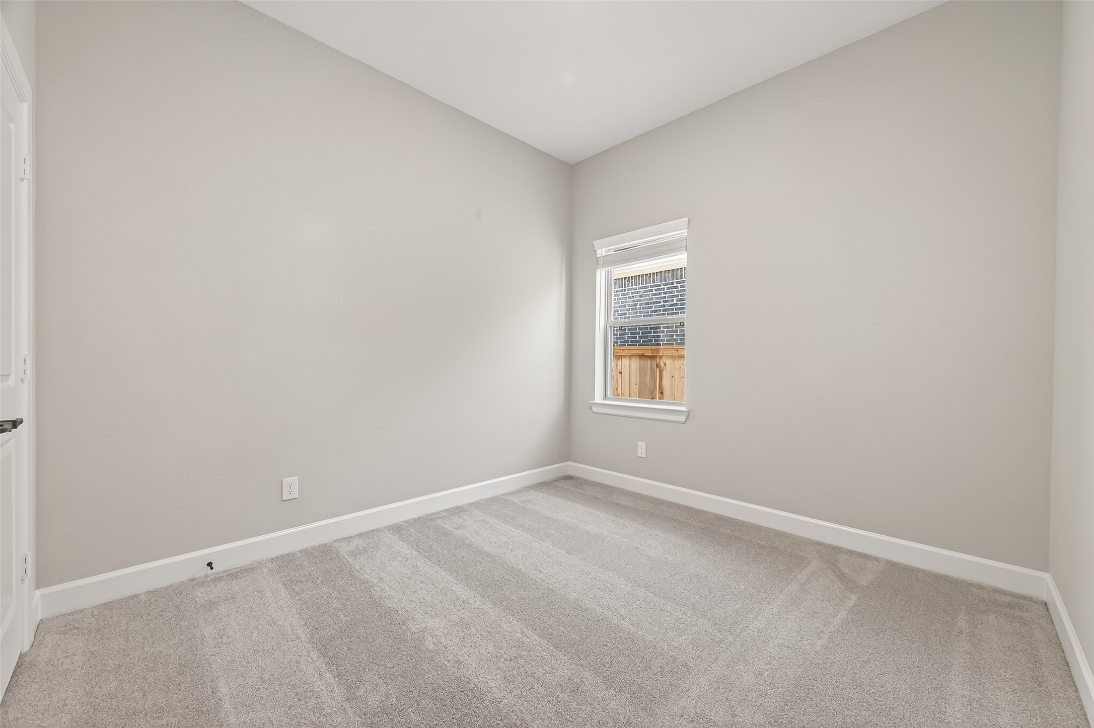 11219 Peacock Flower Street Cypress, TX 77433 - Photo 29 of 50 an empty room with a window