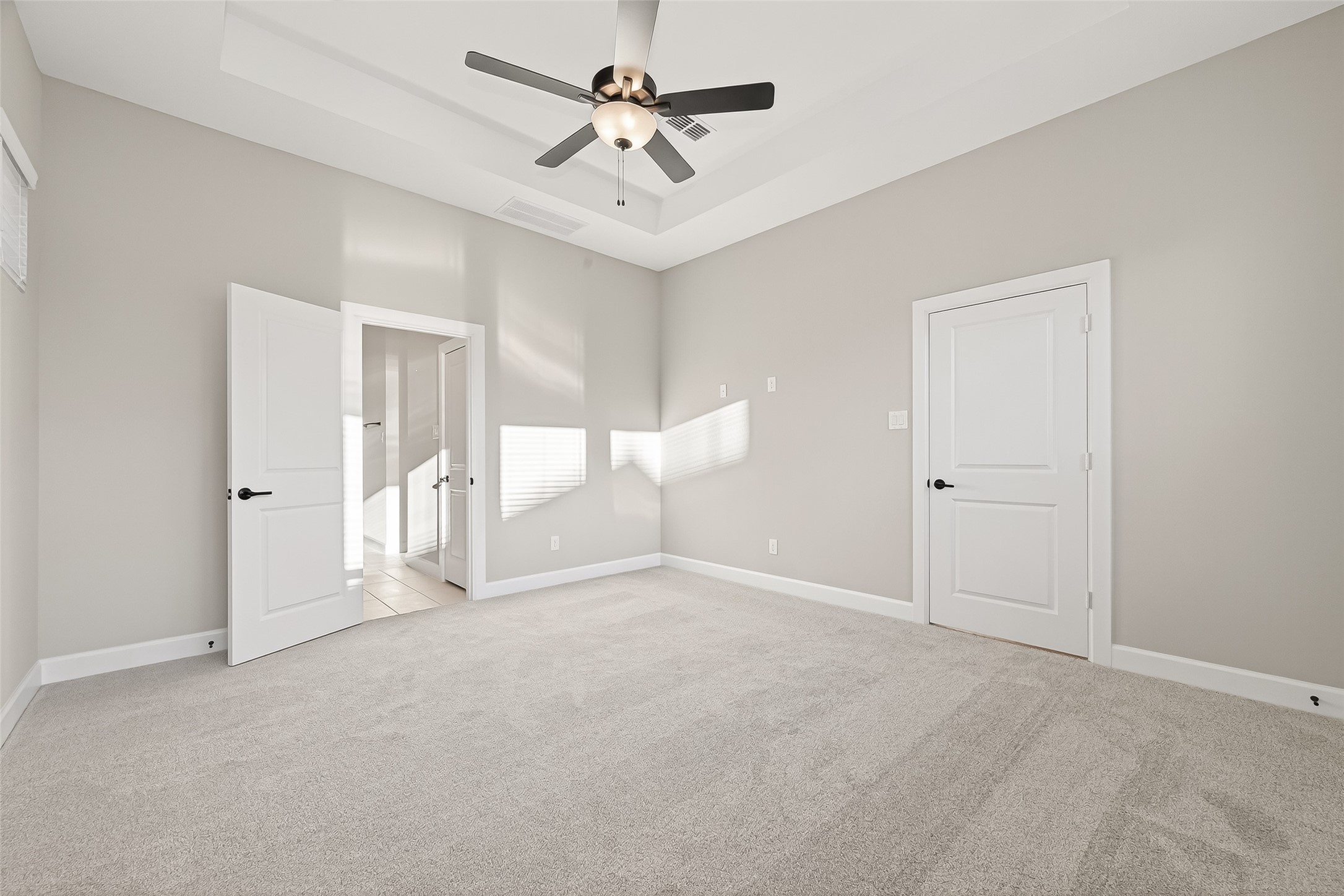 11219 Peacock Flower Street Cypress, TX 77433 - Photo 35 of 50 a view of an empty room and a ceiling fan window