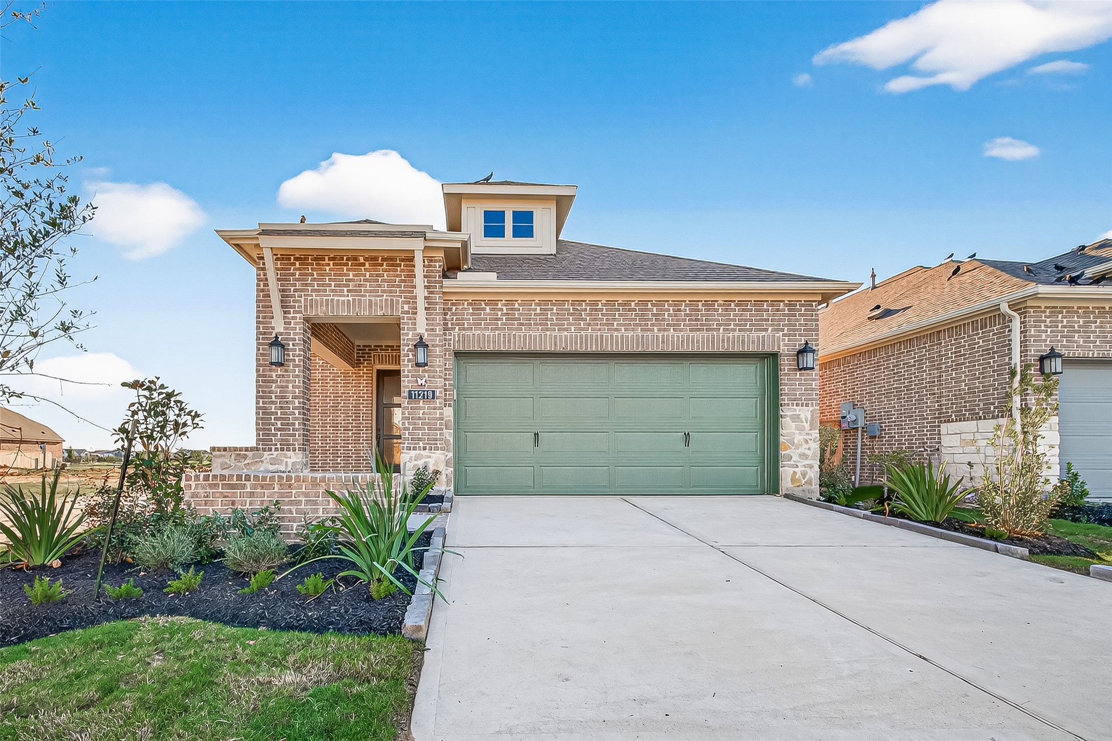 11219 Peacock Flower Street Cypress, TX 77433 - Photo 4 of 50 a front view of a house with garden