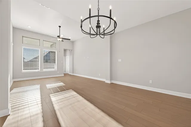 a view of livingroom with hardwood floor and a ceiling fan