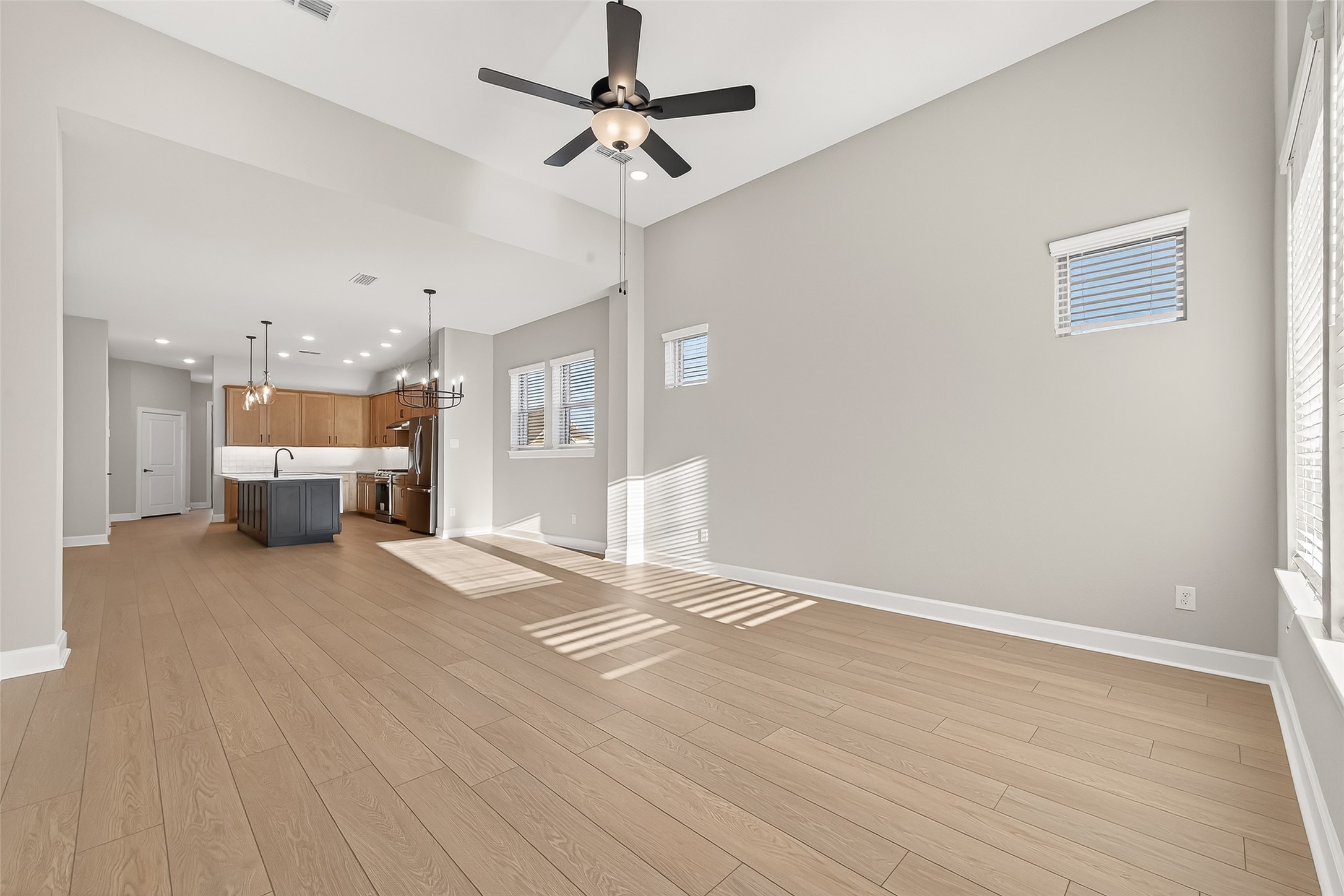 11219 Peacock Flower Street Cypress, TX 77433 - Photo 9 of 50 a view of livingroom with hardwood floor and a ceiling fan