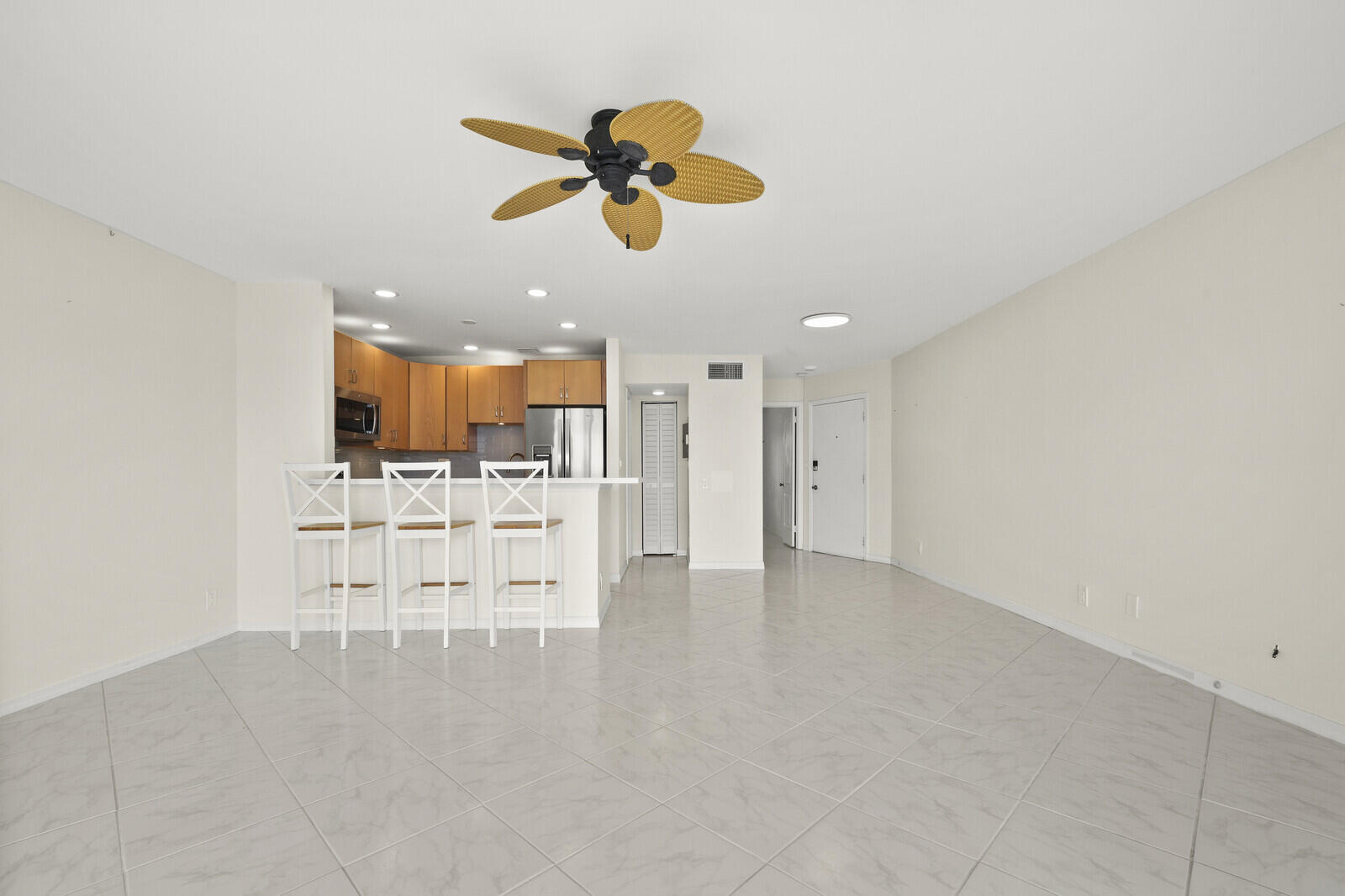 400 Wilma Circle, Unit 207 Riviera Beach, FL 33404 - Photo 20 of 26 a view of kitchen with cabinets and wooden floor
