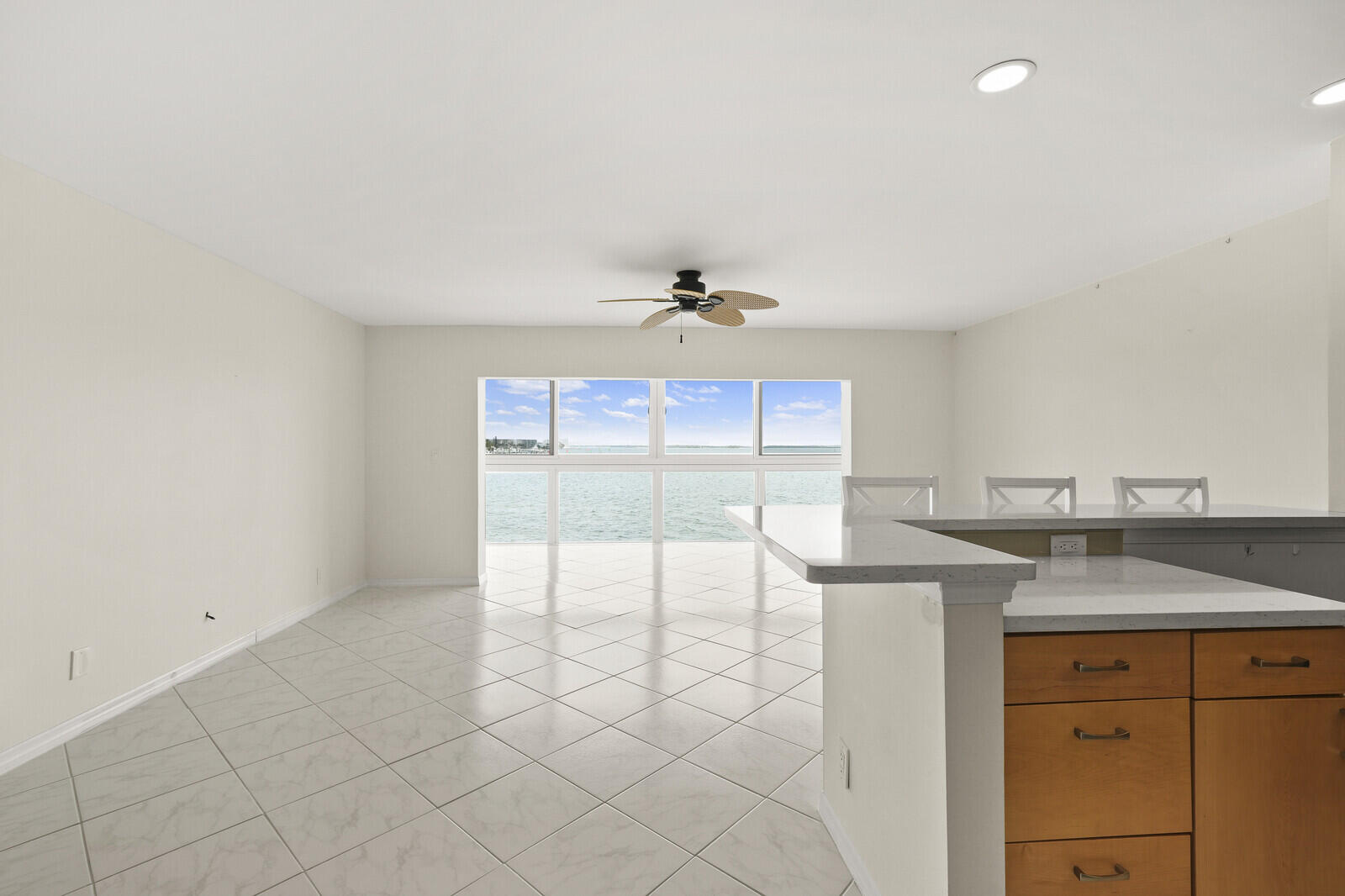 400 Wilma Circle, Unit 207 Riviera Beach, FL 33404 - Photo 4 of 26 a kitchen with granite countertop a sink and a cabinets