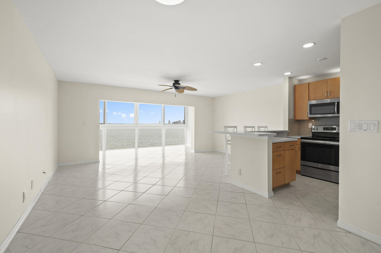 400 Wilma Circle, Unit 207 Riviera Beach, FL 33404 - Photo 5 of 26 a view of a kitchen with a sink and an oven