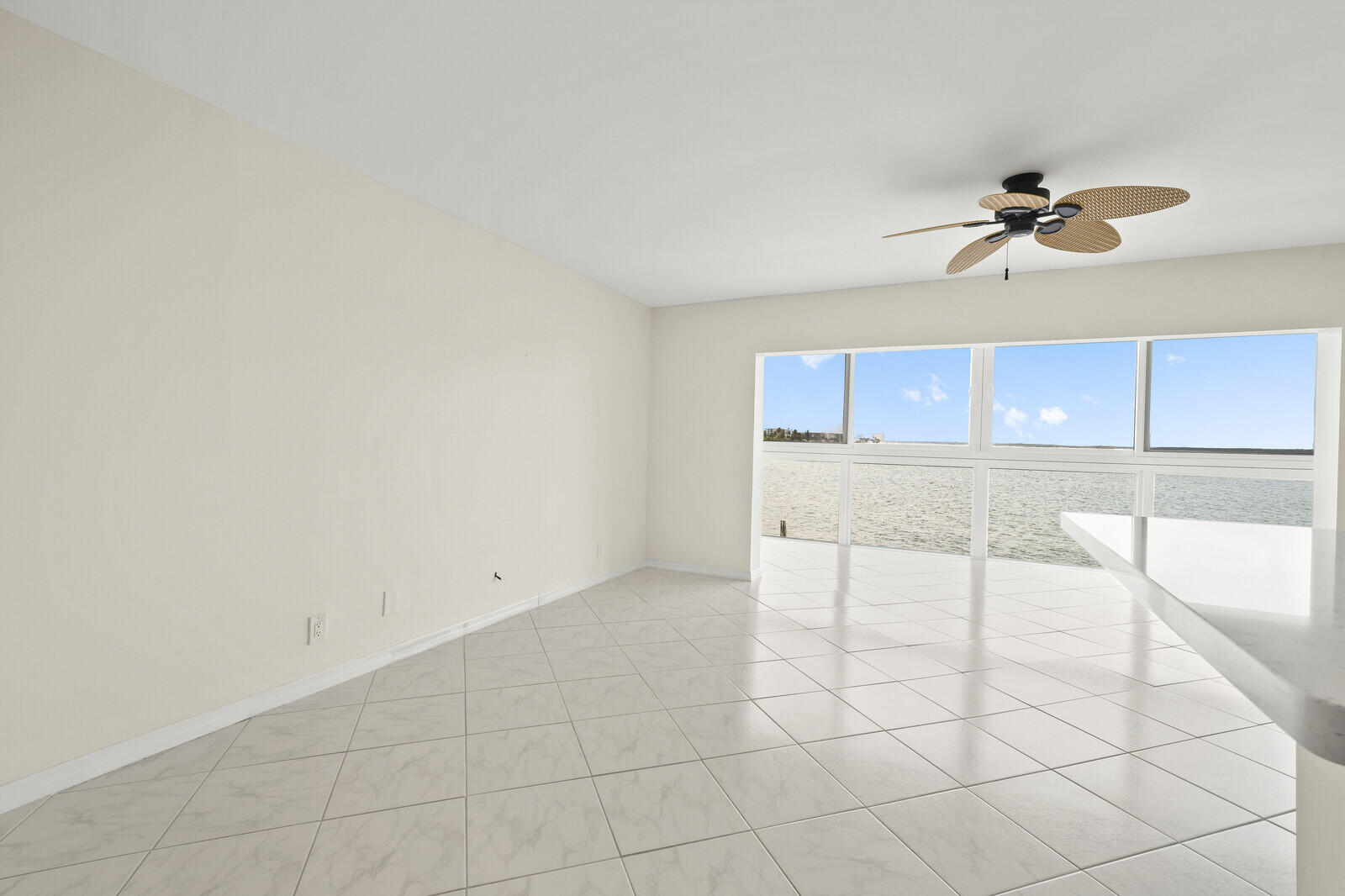 400 Wilma Circle, Unit 207 Riviera Beach, FL 33404 - Photo 7 of 26 an empty room with kitchen view