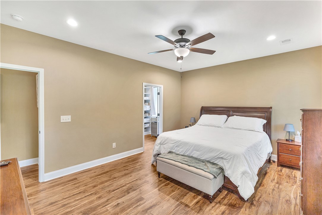 3004 Cobbs Way Anderson, SC 29621 - Photo 18 of 46 Gleaming hardwood floors run throughout this comfortable bedroom under a smooth ceiling with recessed lighting.