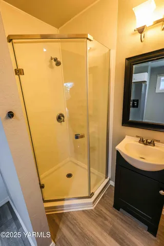a bathroom with a sink and a mirror